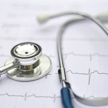 Healthy concept: Stethoscope and electrocardiogram (ECG, EKG).