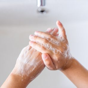 Hygiene concept. Kid washing hands with soap.