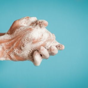 Closeup of person washing hands isolated. Cleanliness and body care concept.  