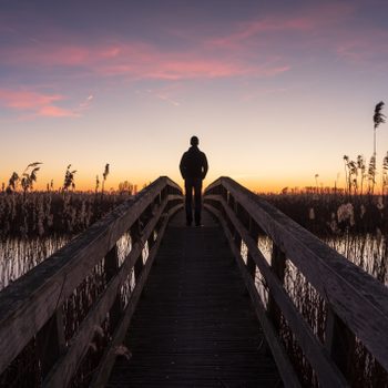 man looking at the sunset