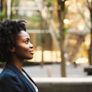 profile of young woman walking with confidence