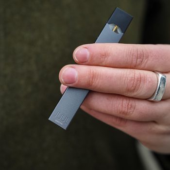 Woman holding Juul e-cig