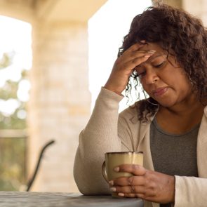 African American middle age woman looking sad.