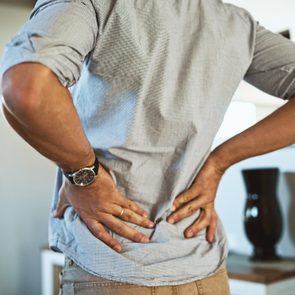 lower back pain and stretch close up