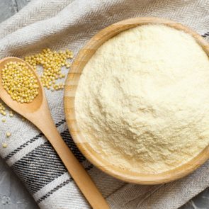 Hulled millet flour and grain top view