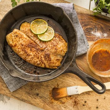 Tilapia on frying pan