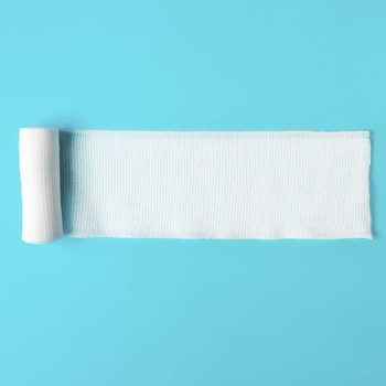 medical bandage on bright blue background